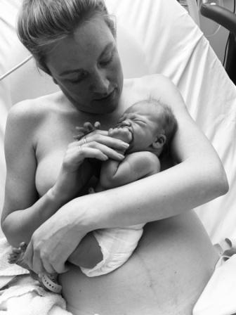 mum with newborn after birth pool birt 